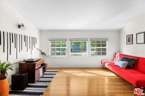 a bedroom with furniture and a window