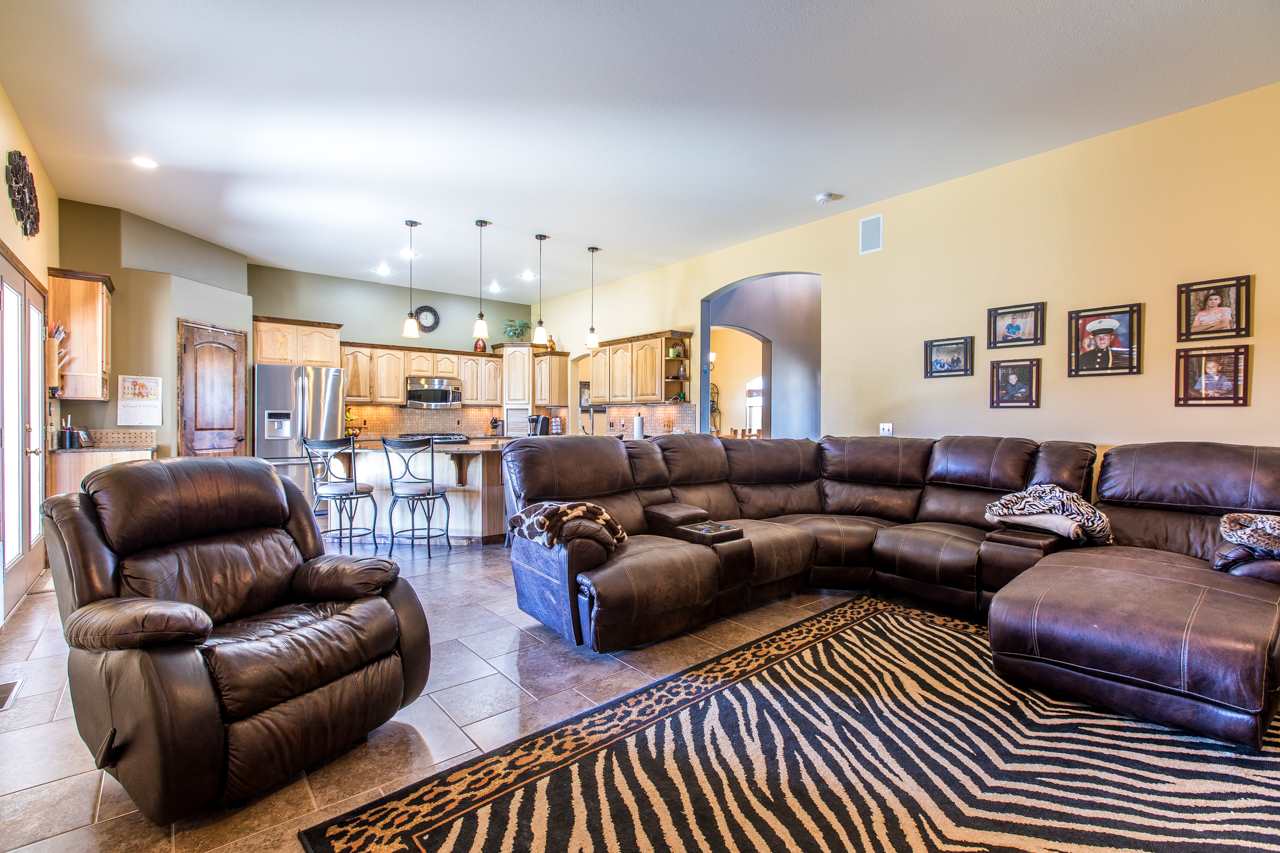 1206 Signal Rock Road Grand Junction, CO 81505 - Photo 13 of 39 a living room with furniture and wooden floor