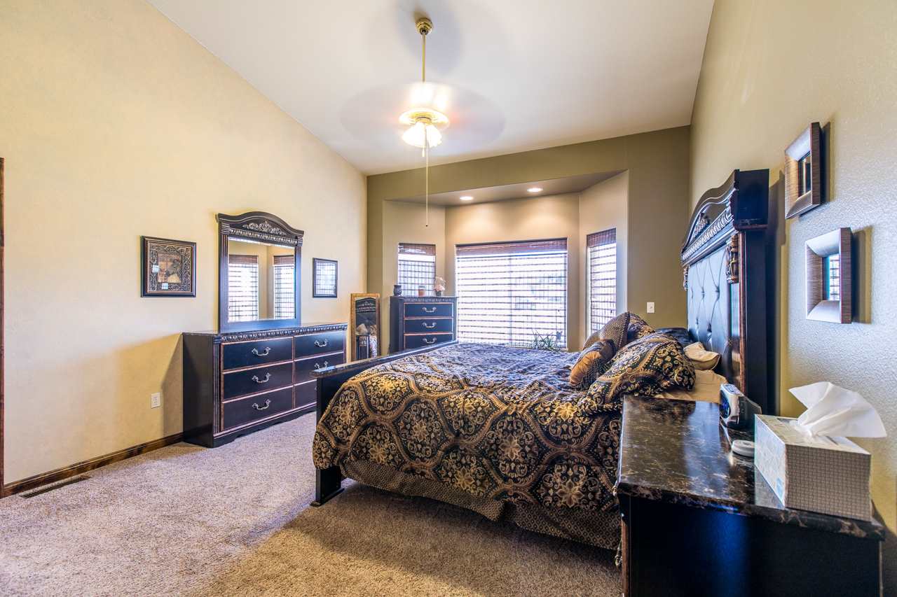 1206 Signal Rock Road Grand Junction, CO 81505 - Photo 28 of 39 a bed room with a bed and a window