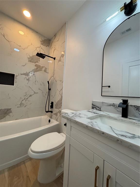 317 Quail Avenue Sebring, FL 33870 - Photo 12 of 19 a bathroom with a granite countertop sink toilet and shower