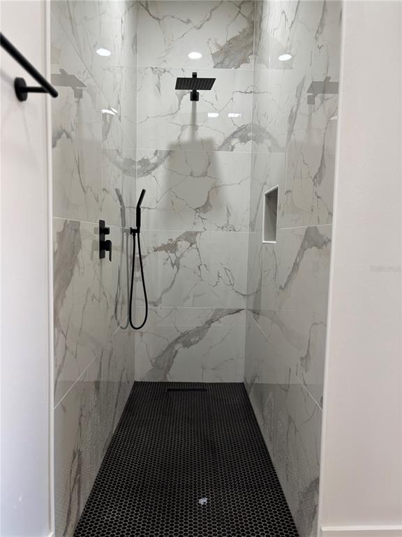 317 Quail Avenue Sebring, FL 33870 - Photo 15 of 19 a bathroom with a shower
