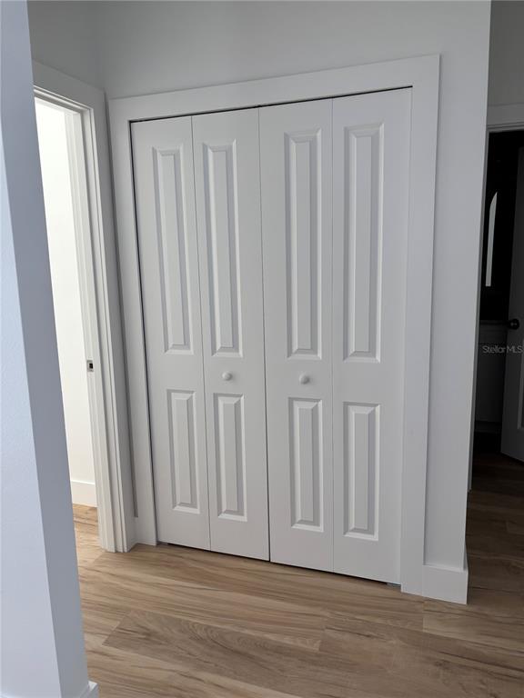 317 Quail Avenue Sebring, FL 33870 - Photo 18 of 19 a view of a door with wooden floor