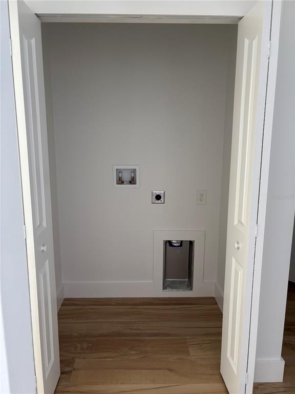 317 Quail Avenue Sebring, FL 33870 - Photo 19 of 19 a view of a hallway with wooden floor