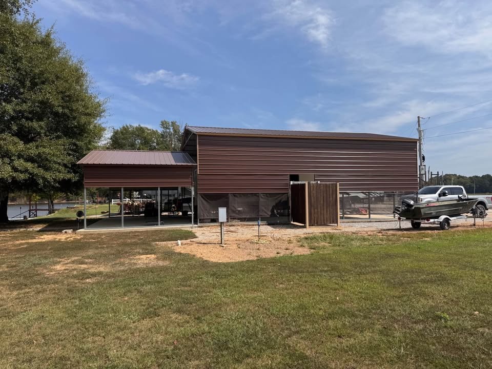 0 Ds Cove Decaturville, TN 38329 - Photo 33 of 60 a front view of a house with a yard and garage