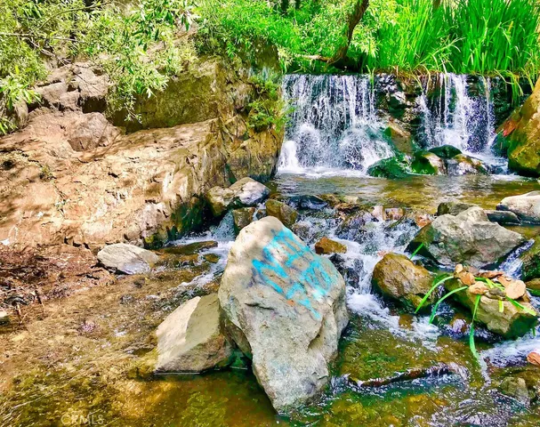 a view of swimming pool from a lake view