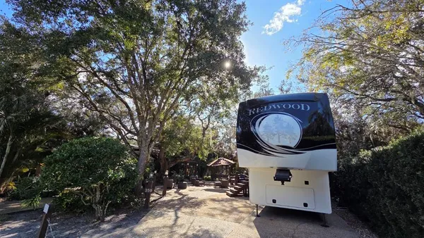 a view of a house with a sink and a tree