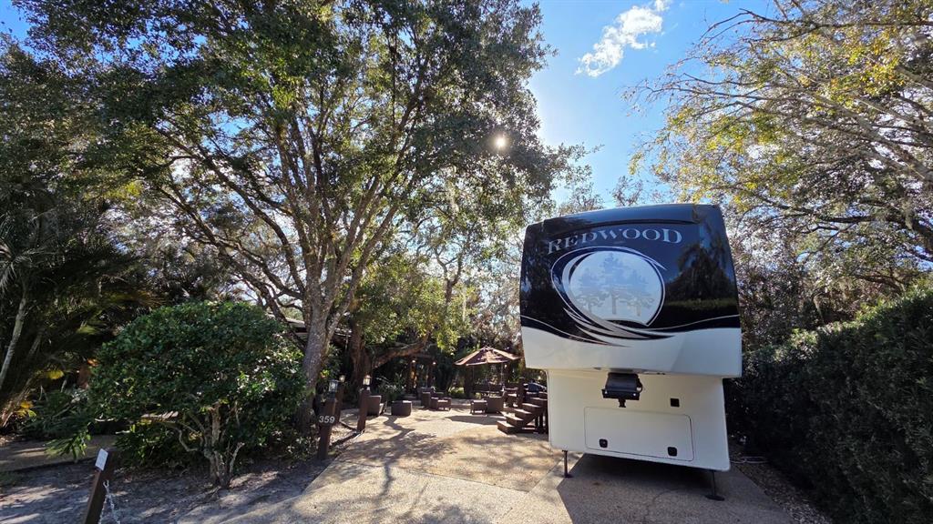 a view of a house with a sink and a tree