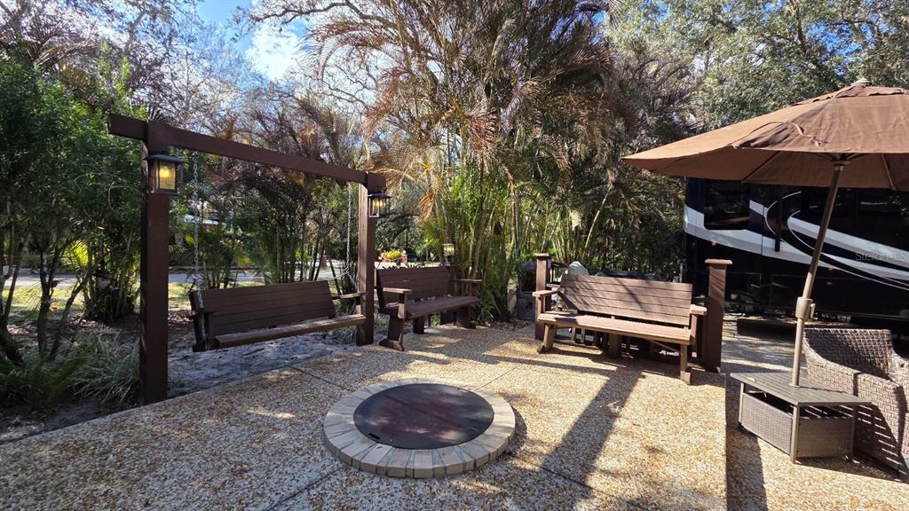 359 Possum Path River Ranch, FL 33867 - Photo 6 of 21 a view of a backyard with sitting area and furniture