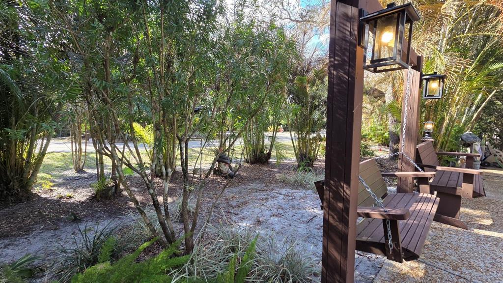 359 Possum Path River Ranch, FL 33867 - Photo 7 of 21 a view of a house with backyard and sitting area