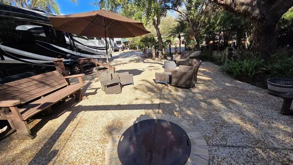 a view of backyard with sitting area