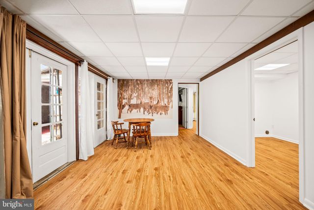 a room with wooden floor and furniture