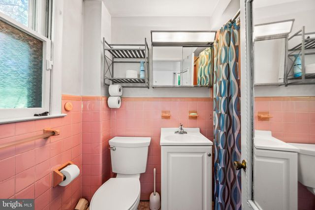 a view of a house with backyard sitting area and garden