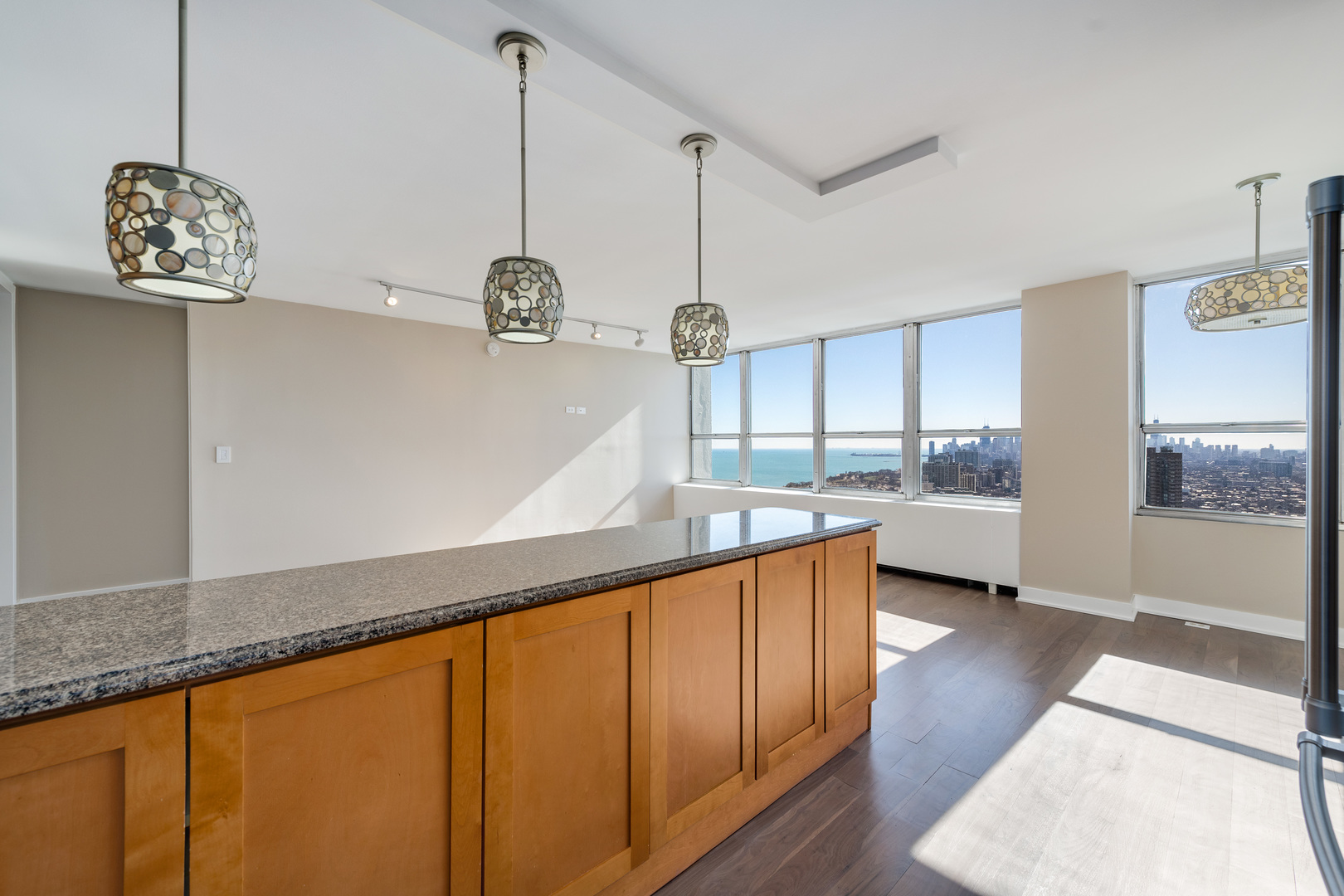 655 West Irving Park Road, Unit 5103 Chicago, IL 60613 - Photo 14 of 30 a kitchen with counter top and outdoor view