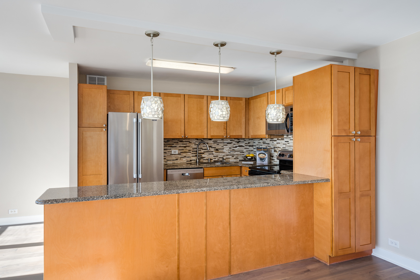655 West Irving Park Road, Unit 5103 Chicago, IL 60613 - Photo 8 of 30 a view of a kitchen with a refrigerator a sink and a dishwasher