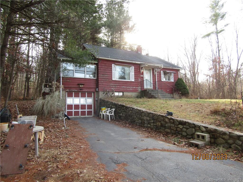 257 Willimantic Road Chaplin, CT 06235 - Photo 1 of 1 a view of a house with a yard covered in snow