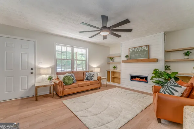 a living room with furniture and a fireplace