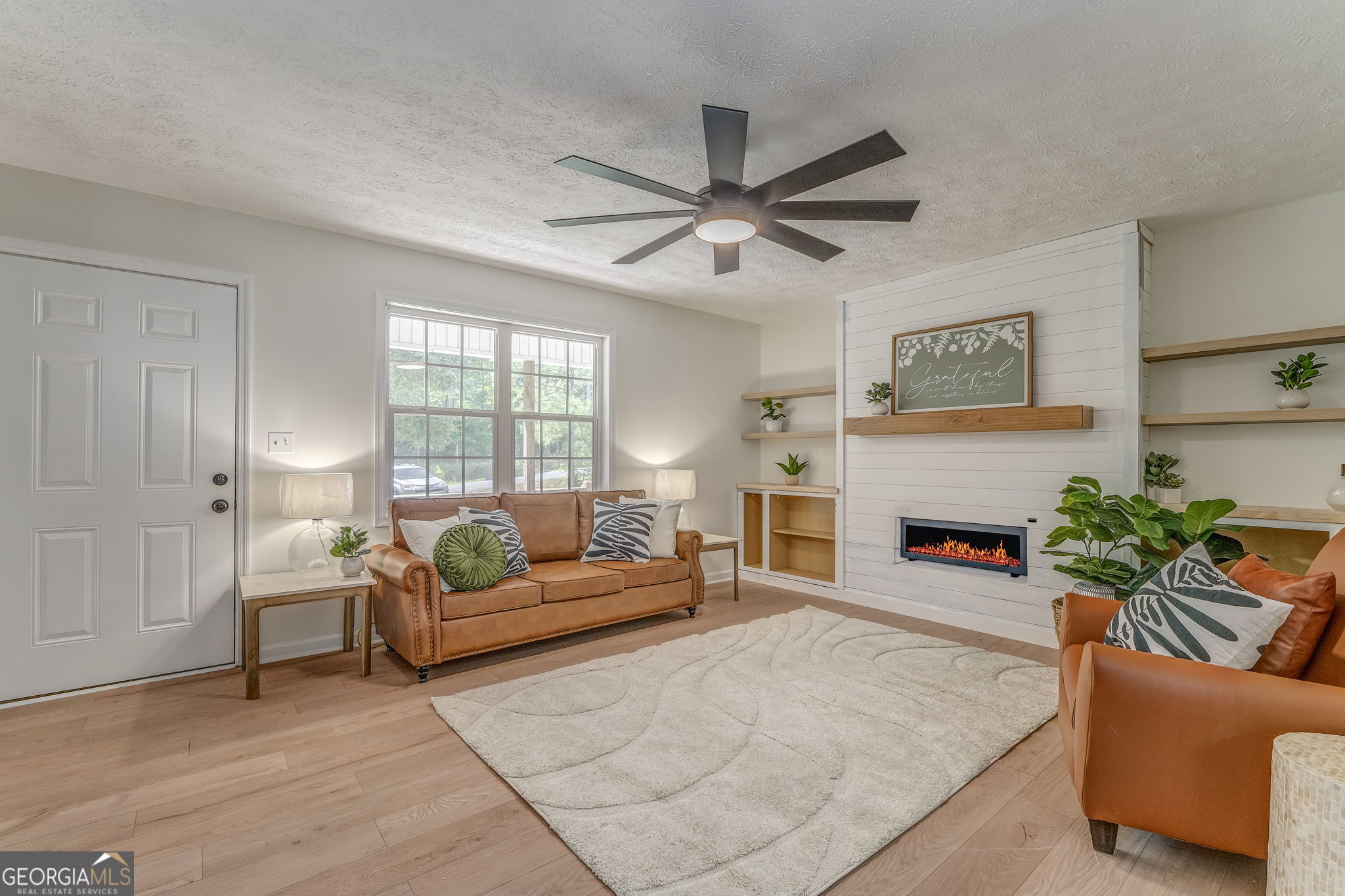 728 Hutto Road Cedartown, GA 30125 - Photo 12 of 40 a living room with furniture and a fireplace