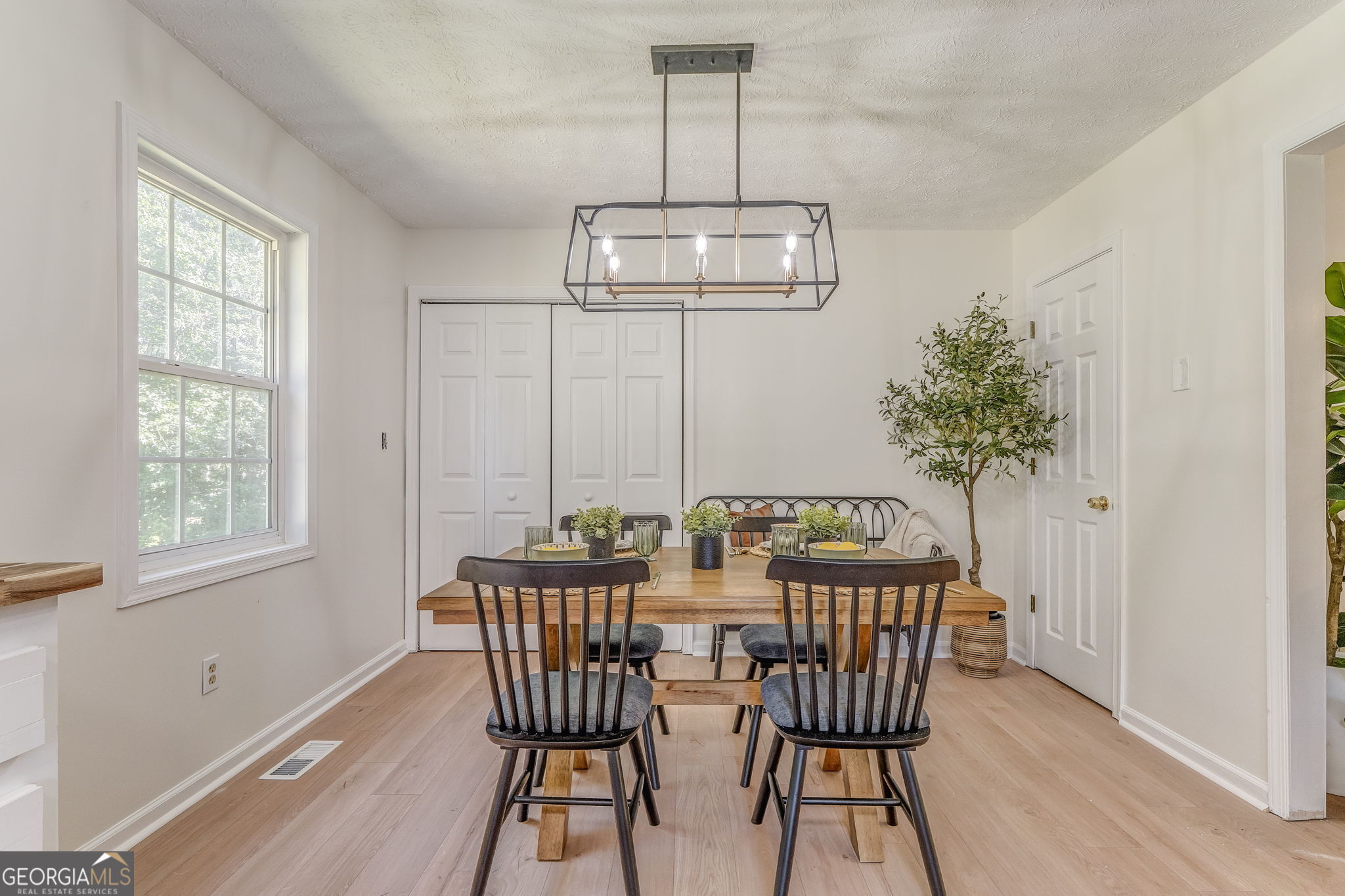 728 Hutto Road Cedartown, GA 30125 - Photo 13 of 40 a view of a dining room with furniture window and wooden floor
