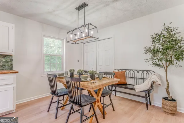 a view of a dining room with furniture window and outside view
