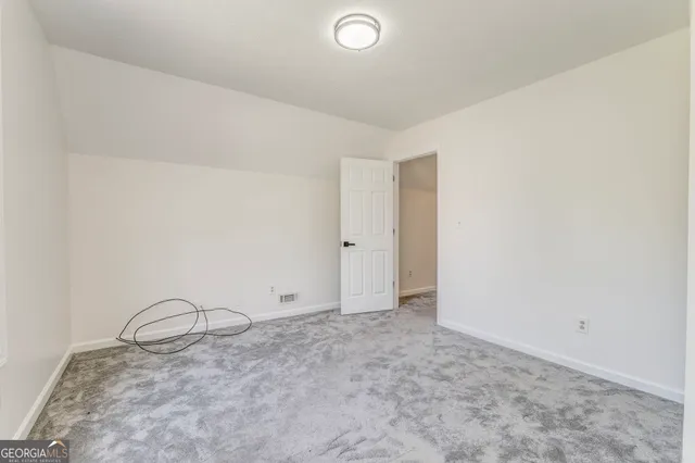 a view of a livingroom with a dry plant