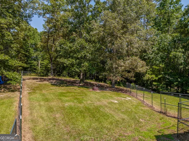 a view of a swimming pool with an outdoor seating