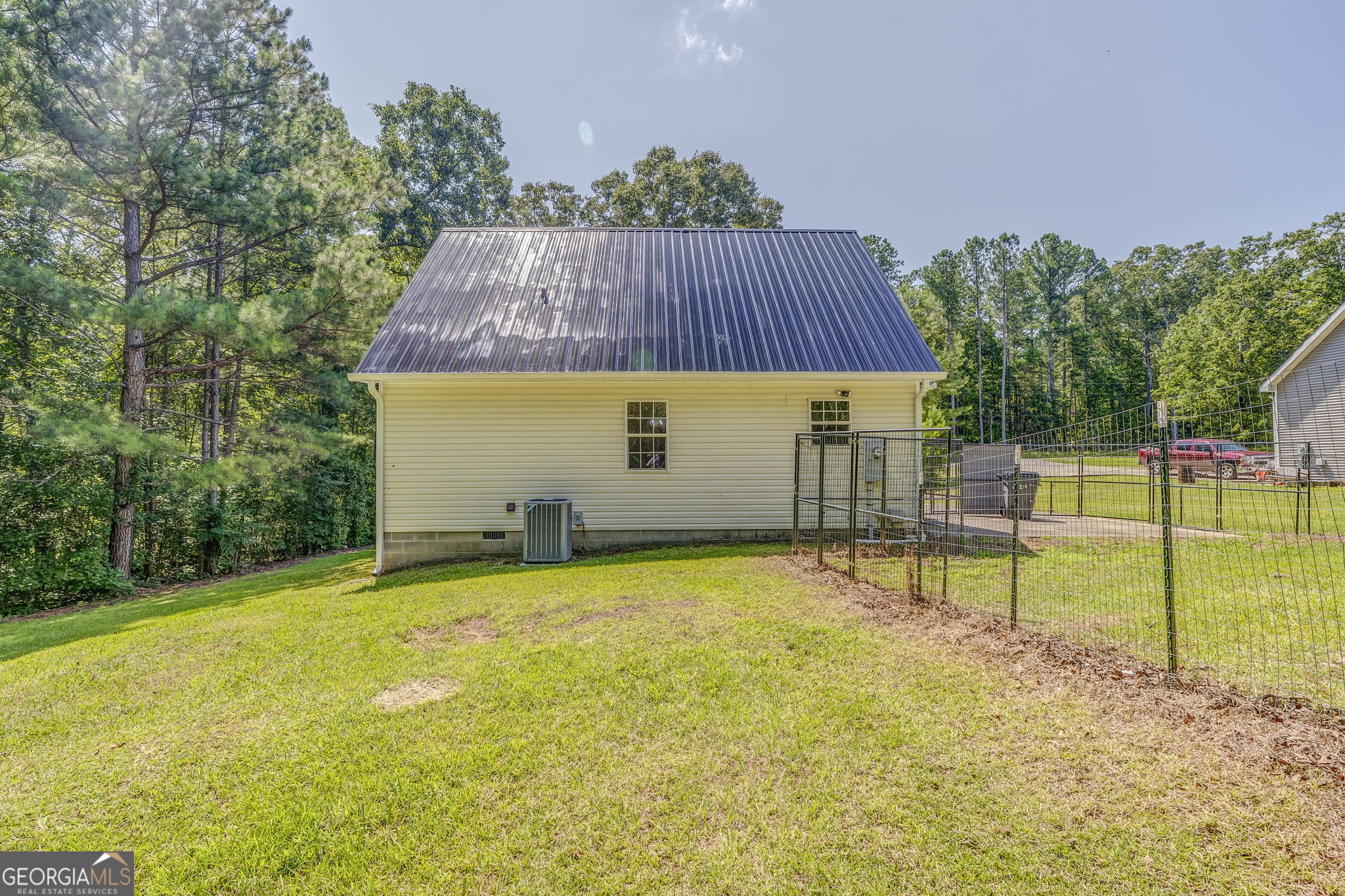 728 Hutto Road Cedartown, GA 30125 - Photo 4 of 40 a view of a house with backyard and a swimming pool