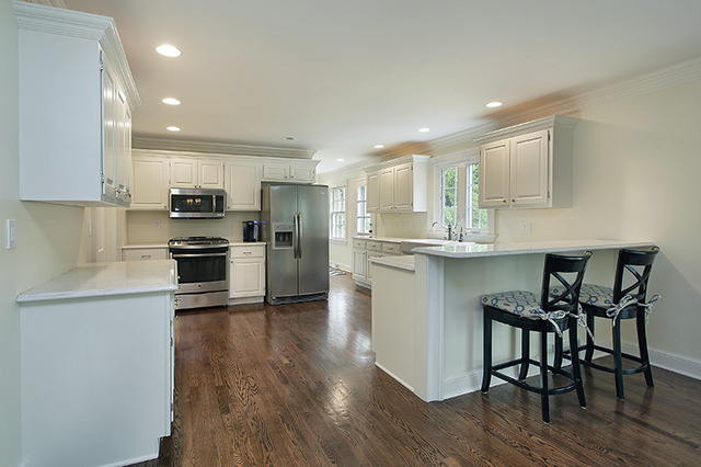 815 Alles Road Winnetka, IL 60093 - Photo 6 of 20 a kitchen with kitchen island white cabinets and stainless steel appliances