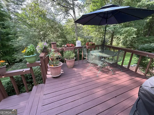 a view of deck with seating space and garden