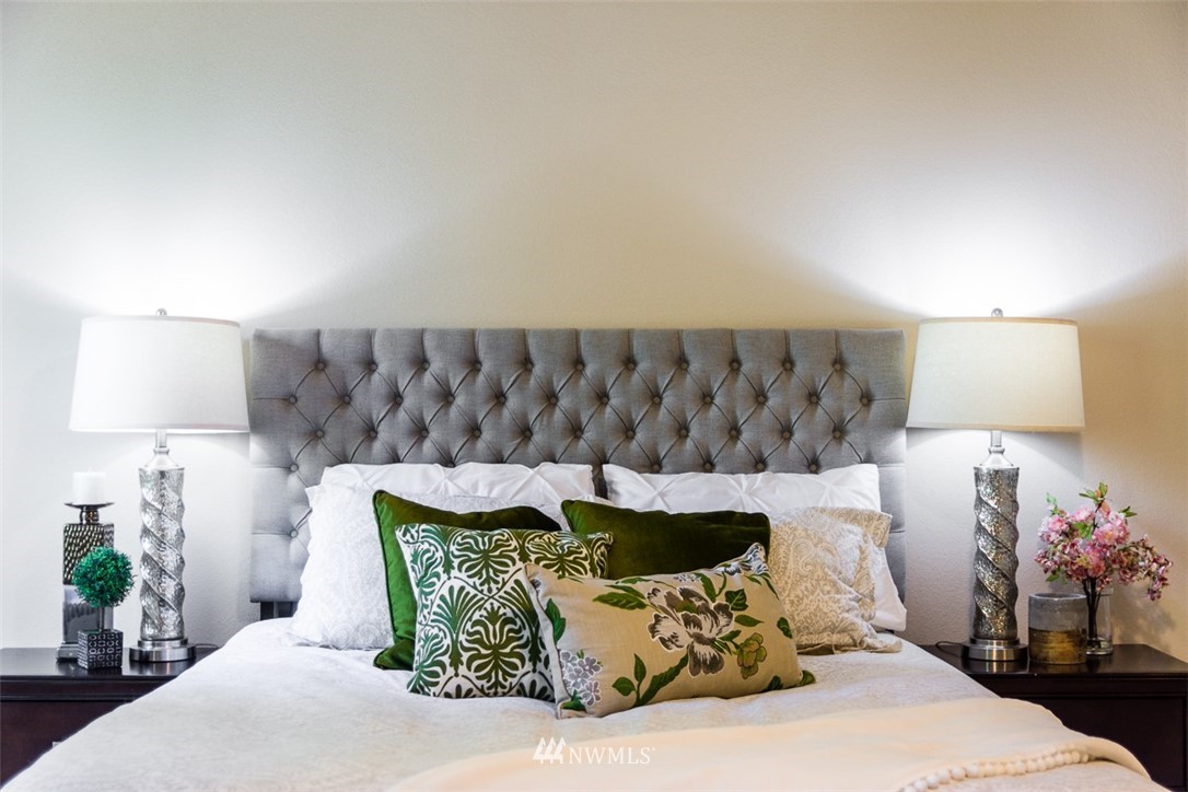 2719 232nd Street Southeast Bothell, WA 98021 - Photo 14 of 24 a bed room with a bed and a lamp