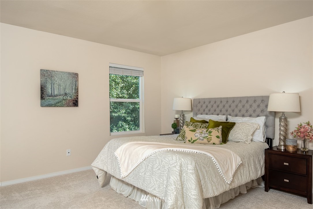 2719 232nd Street Southeast Bothell, WA 98021 - Photo 15 of 24 a bedroom with a bed and window