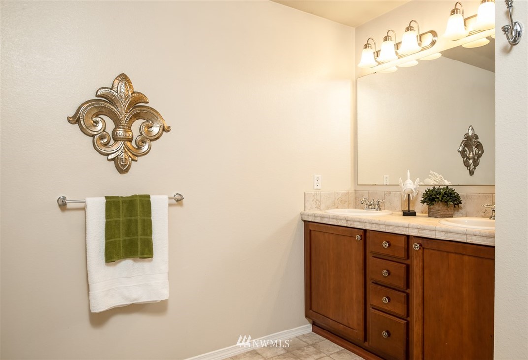 2719 232nd Street Southeast Bothell, WA 98021 - Photo 17 of 24 a bathroom with a sink and a mirror