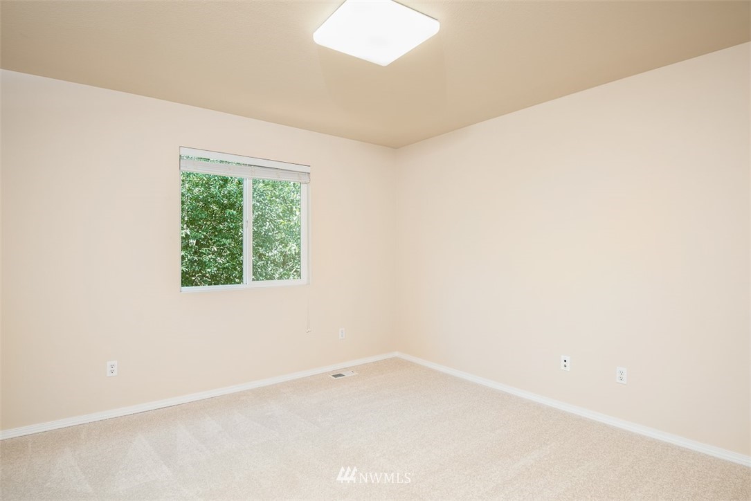 2719 232nd Street Southeast Bothell, WA 98021 - Photo 18 of 24 an empty room with a window