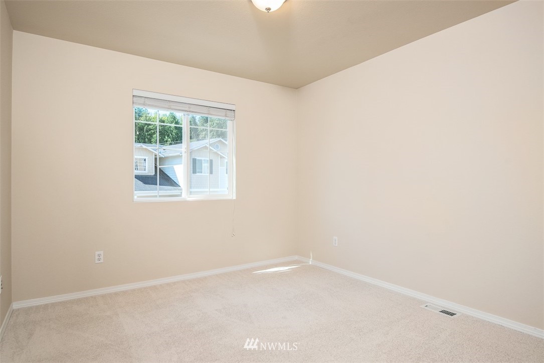 2719 232nd Street Southeast Bothell, WA 98021 - Photo 21 of 24 an empty room with a window