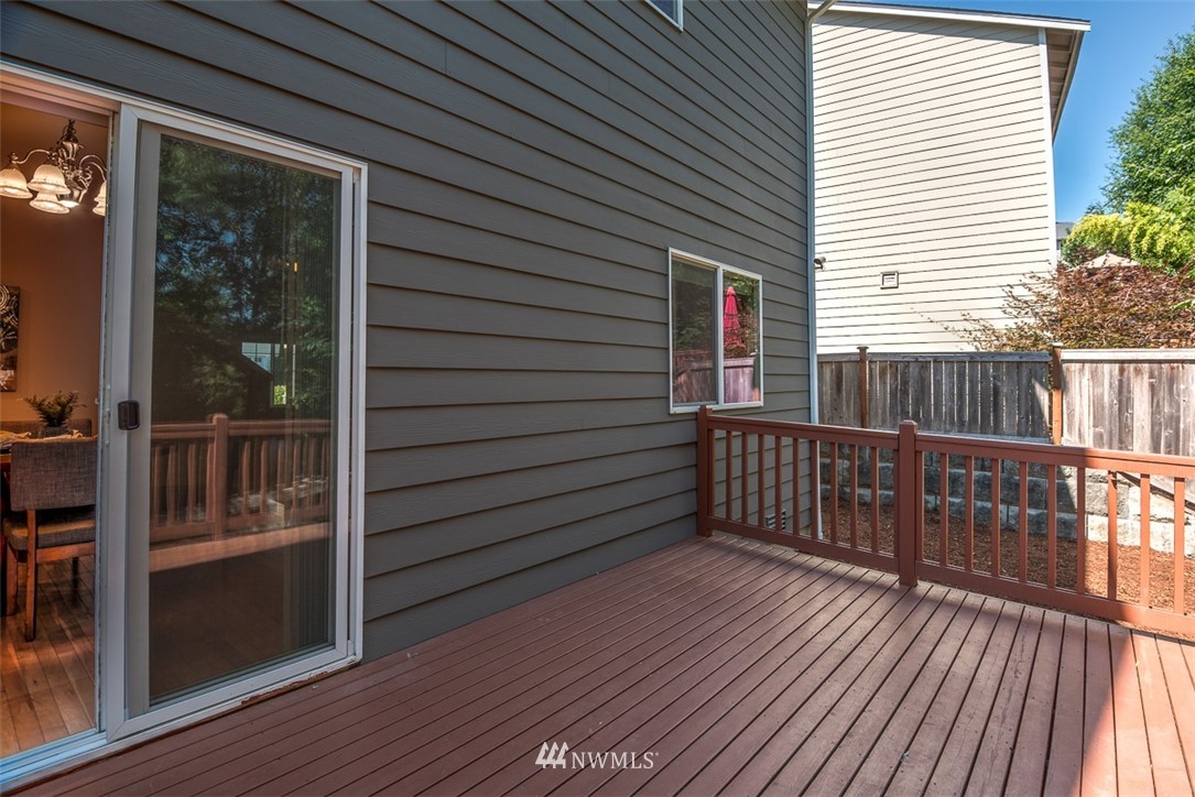 2719 232nd Street Southeast Bothell, WA 98021 - Photo 24 of 24 a view of backyard with a deck and wooden floor