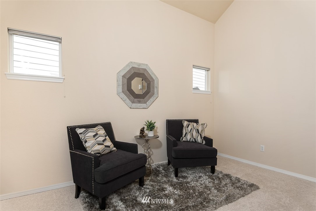 2719 232nd Street Southeast Bothell, WA 98021 - Photo 4 of 24 a living room with furniture and a window
