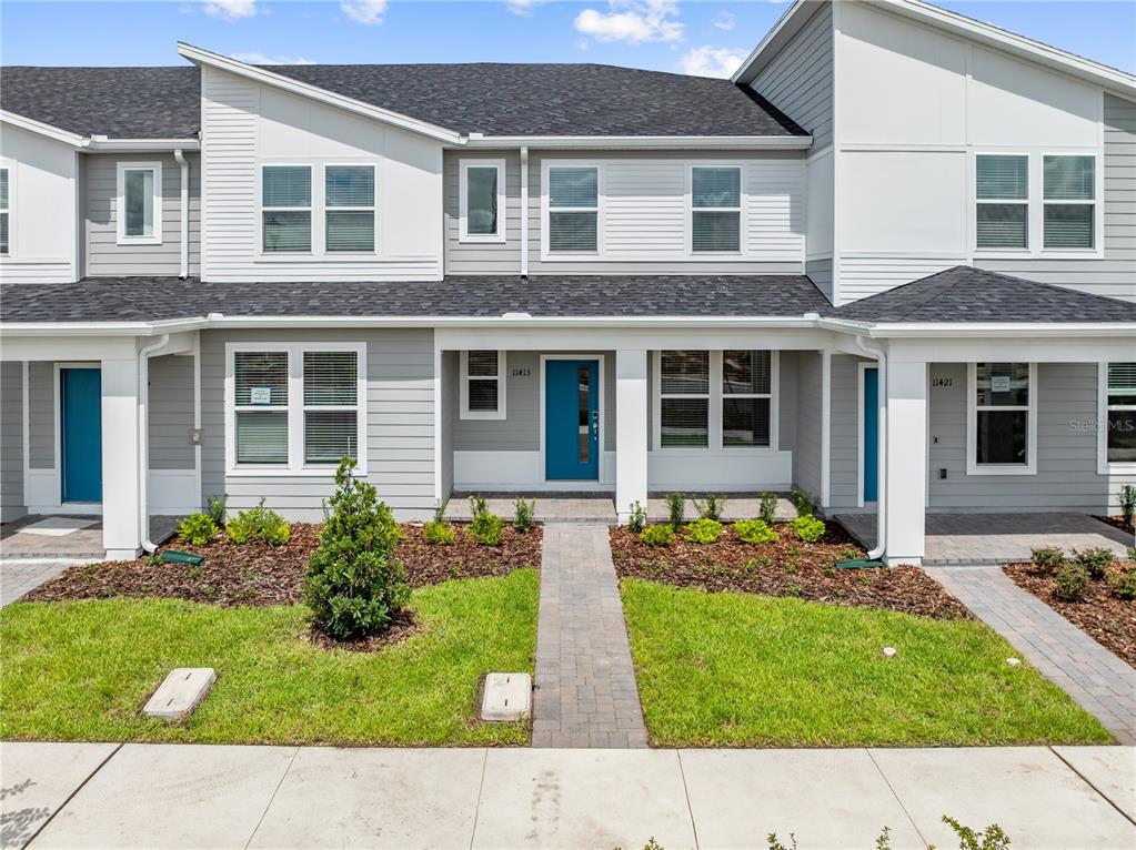 a front view of a house with garden