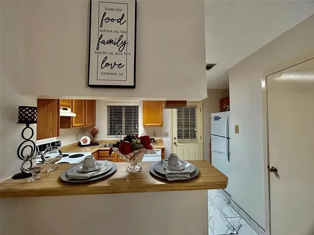 a table with chairs and couches