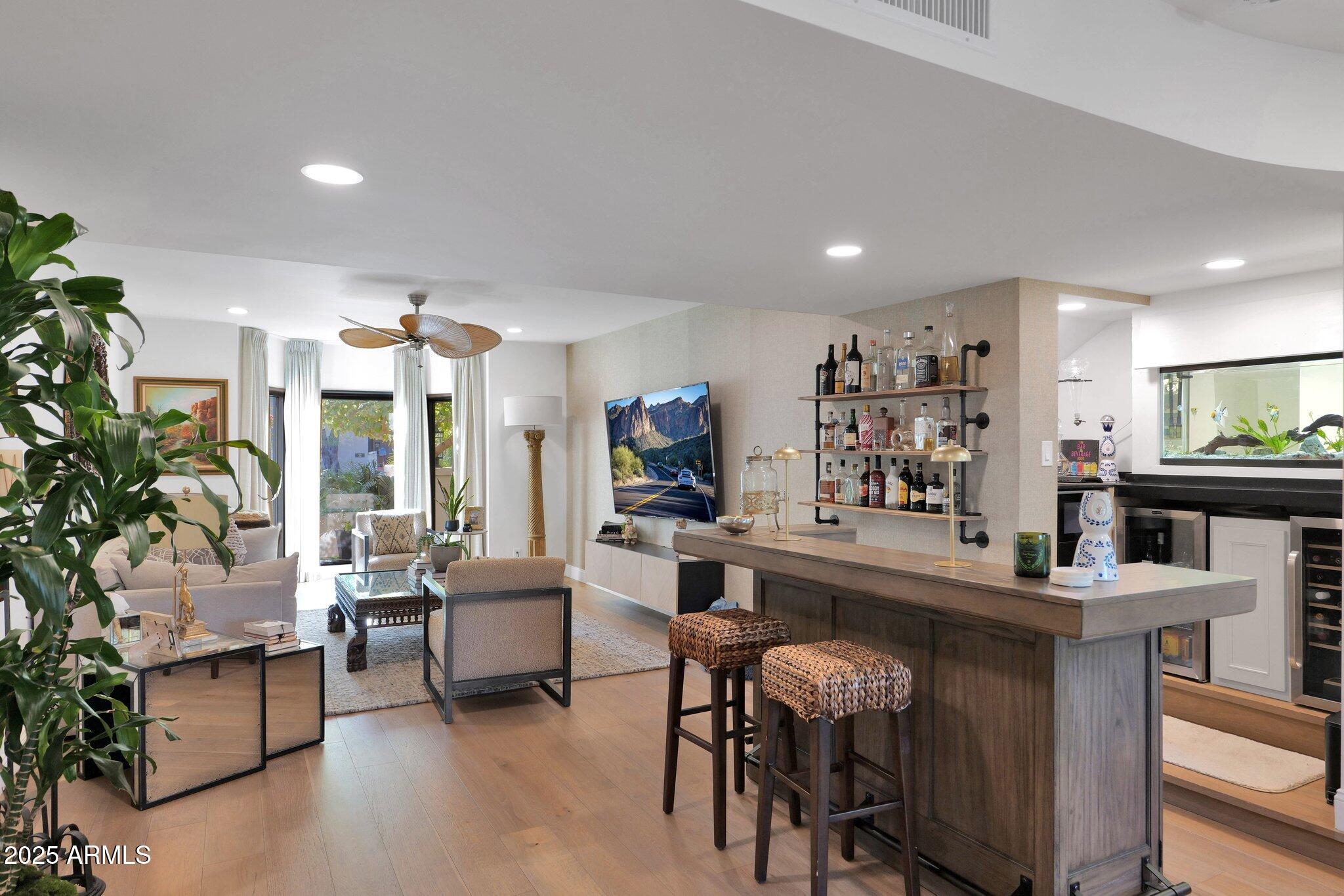 6701 North Scottsdale Road, Unit 24 Scottsdale, AZ 85250 - Photo 11 of 37 a living room with furniture and a large window