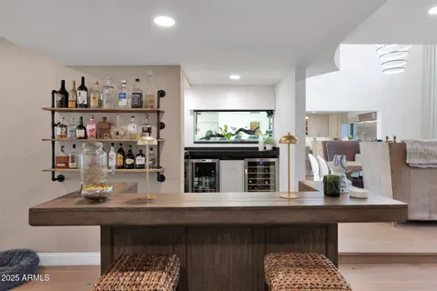 a kitchen area with lots of counter top space and furniture