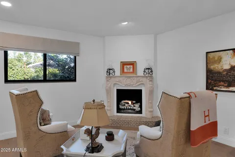 a living room with furniture a window and a fireplace