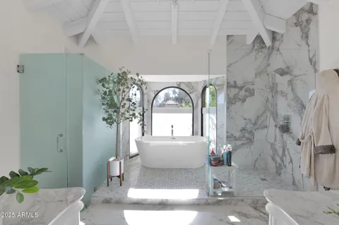 a view of a bathroom with a sink and a mirror
