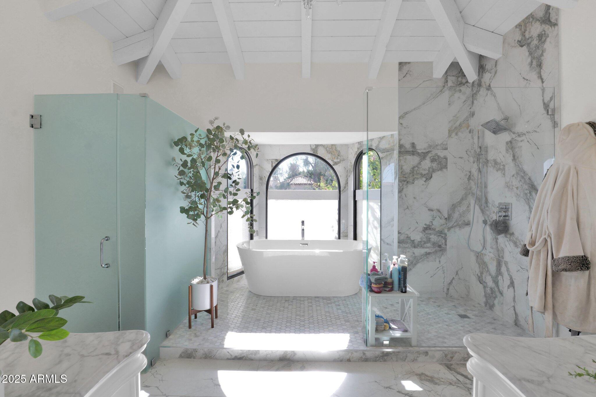 6701 North Scottsdale Road, Unit 24 Scottsdale, AZ 85250 - Photo 18 of 37 a view of a bathroom with a sink and a mirror