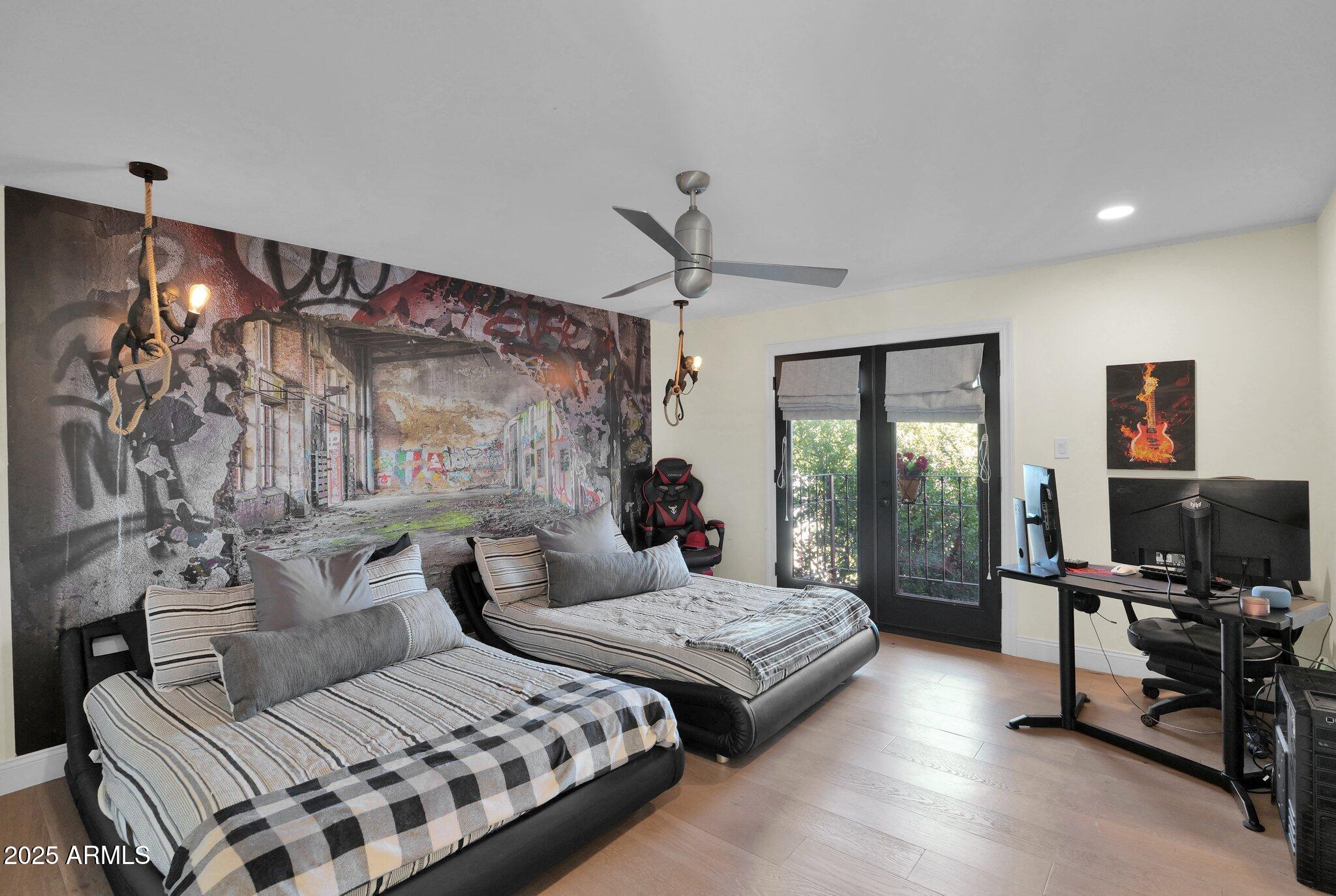 6701 North Scottsdale Road, Unit 24 Scottsdale, AZ 85250 - Photo 23 of 37 a bedroom with a bed couch and a flat tv screen next to a window