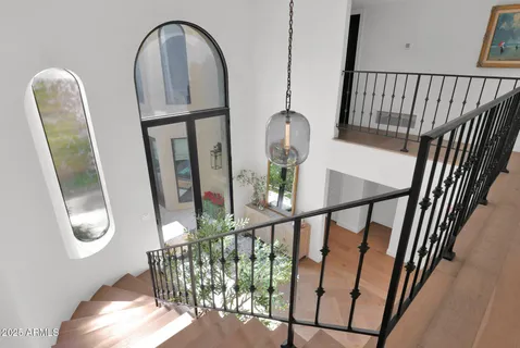 a view of a patio with couches table and chairs and potted plants