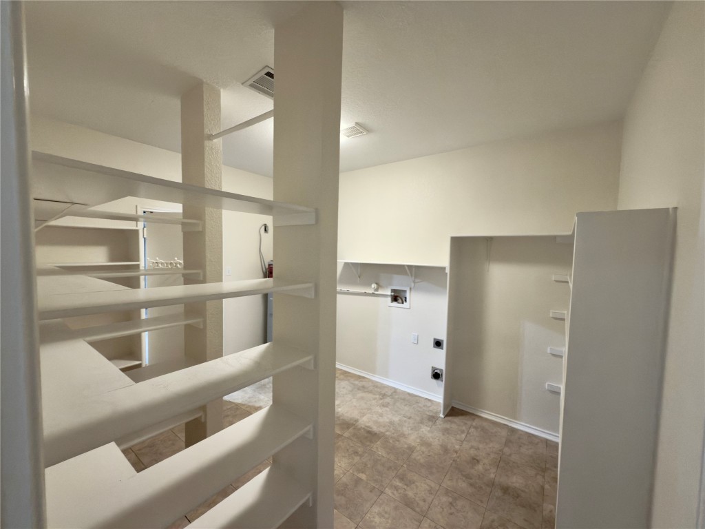 1206 Devil Ridge Cedar Park, TX 78613 - Photo 11 of 38 Hallway featuring baseboards