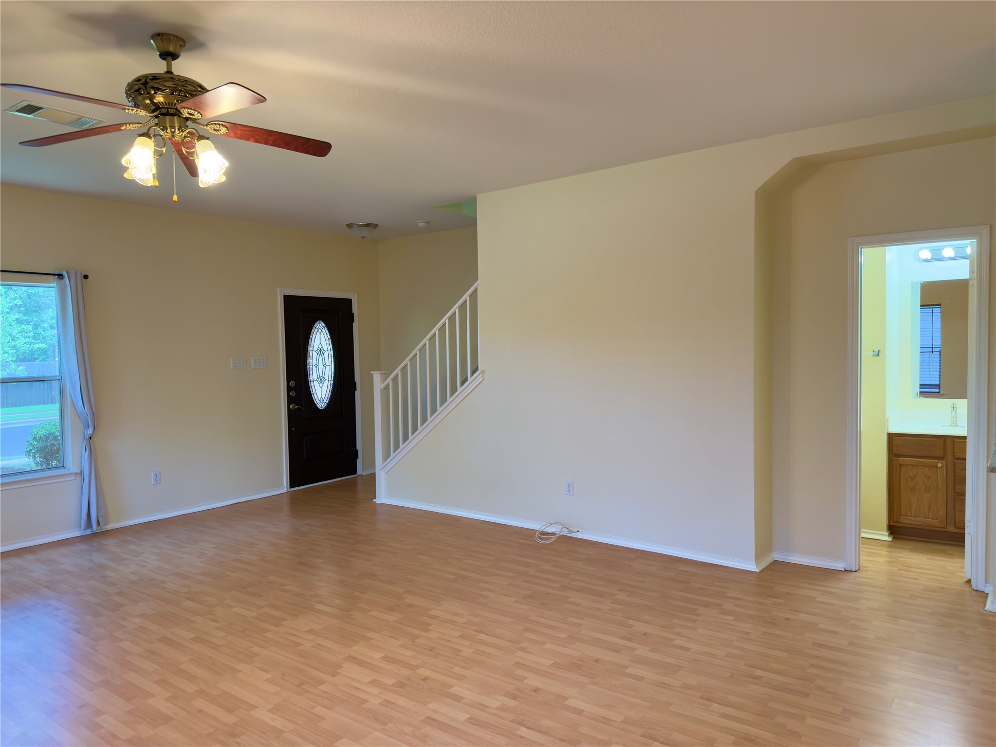 1206 Devil Ridge Cedar Park, TX 78613 - Photo 13 of 38 a view of an empty room with window and wooden floor