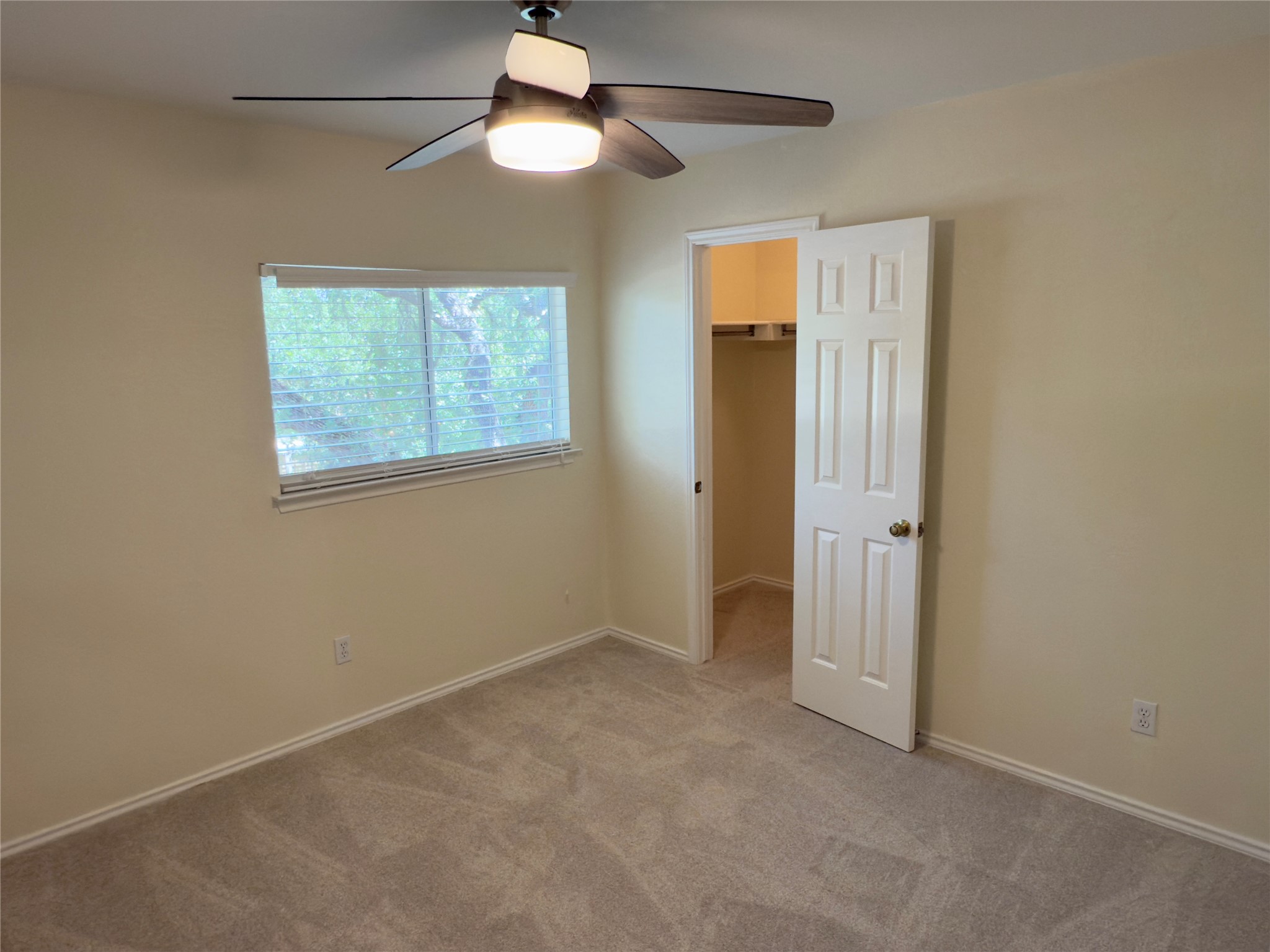 1206 Devil Ridge Cedar Park, TX 78613 - Photo 27 of 38 an empty room with closet and a chandelier fan