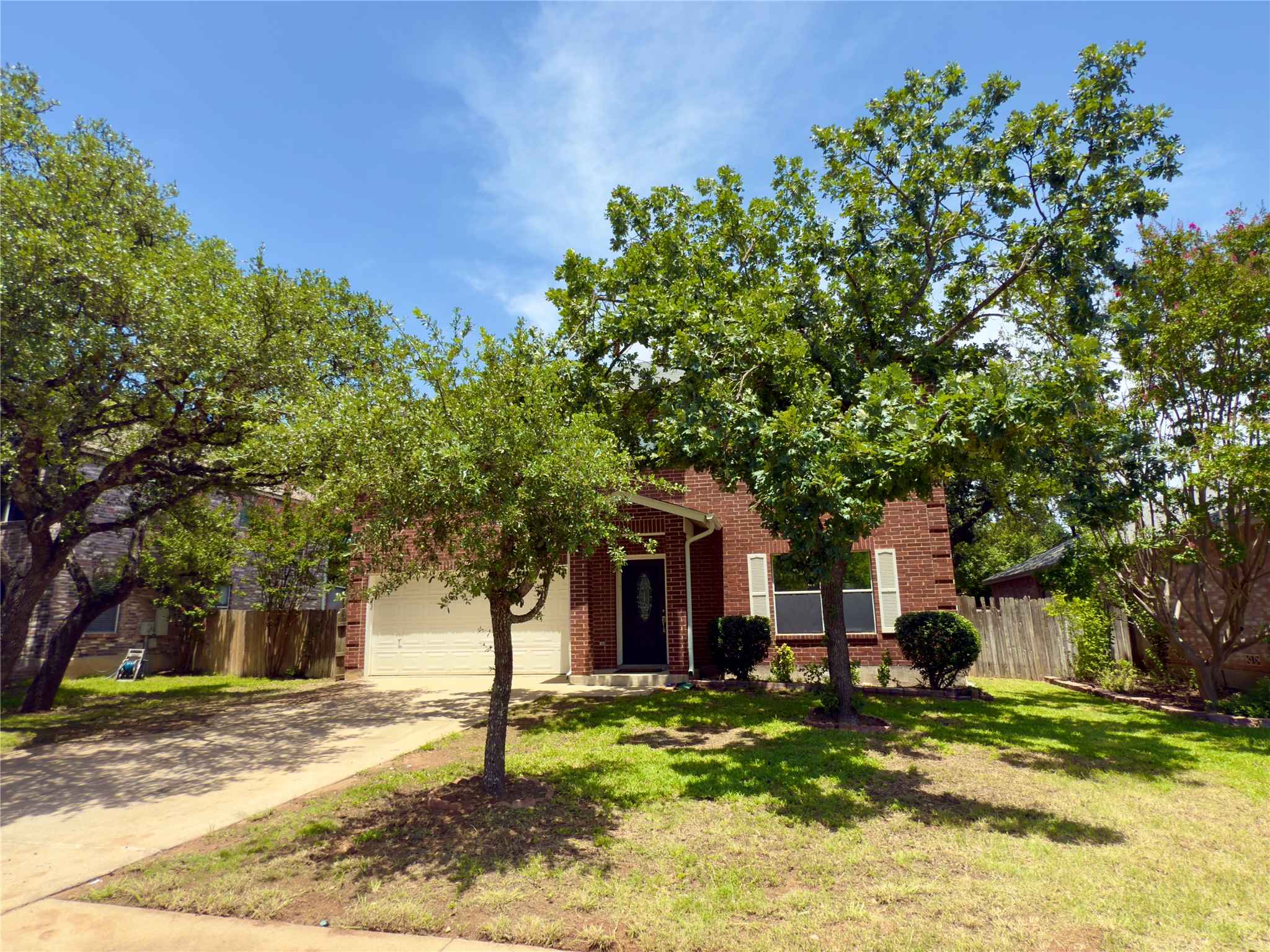 1206 Devil Ridge Cedar Park, TX 78613 - Photo 3 of 38 a front view of a house with a garden
