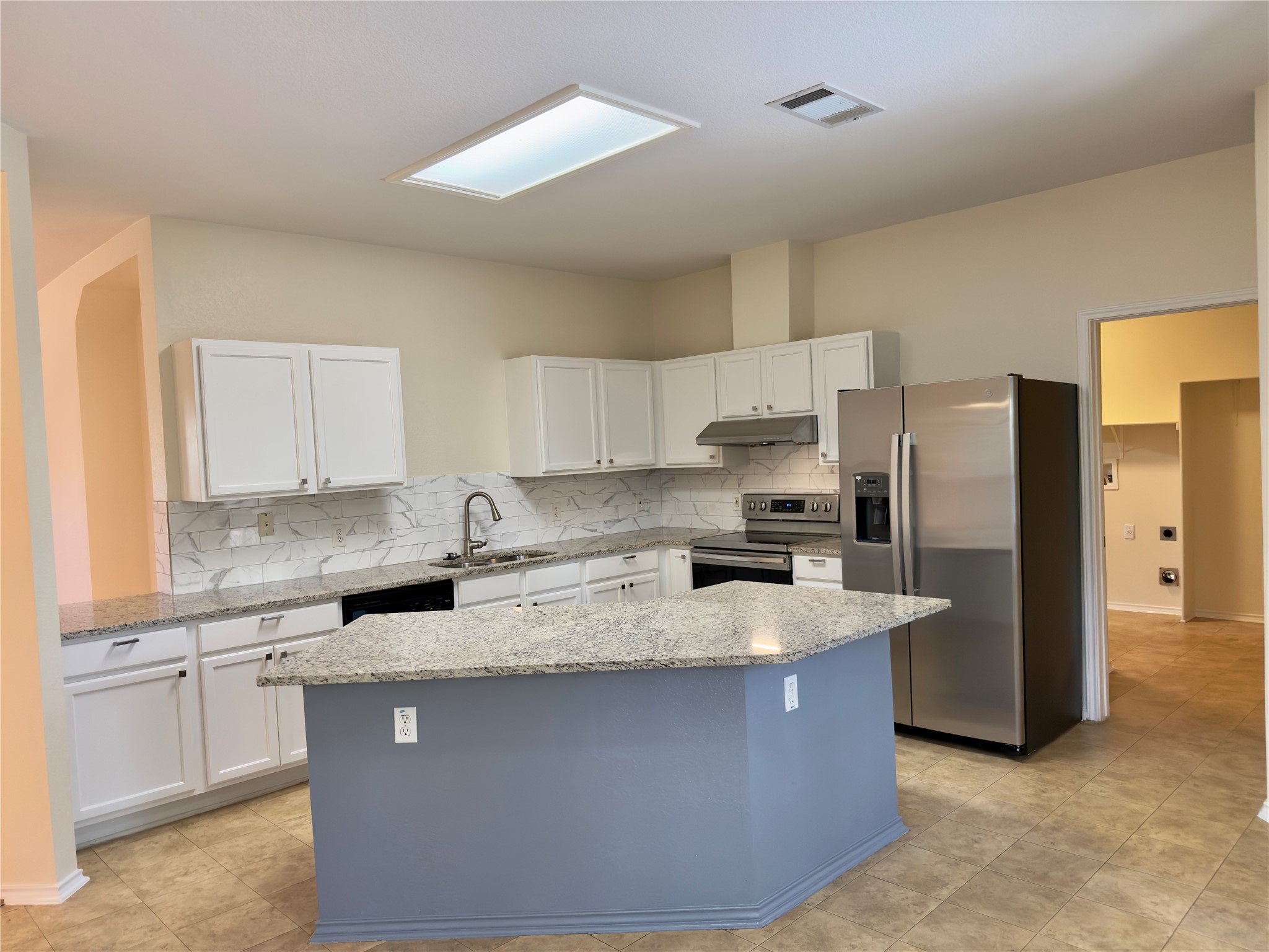 1206 Devil Ridge Cedar Park, TX 78613 - Photo 6 of 38 a kitchen with stainless steel appliances granite countertop a stove a sink and a refrigerator