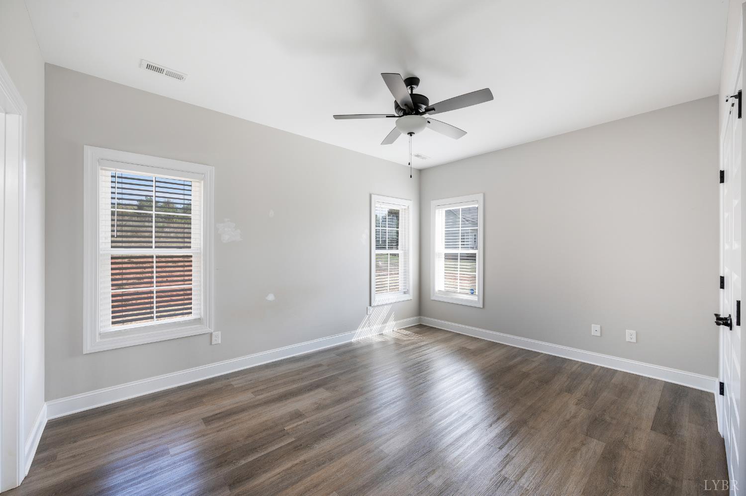 1200 Founding Way Road Bedford, VA 24523 - Photo 11 of 36 a view of an empty room with wooden floor and a window